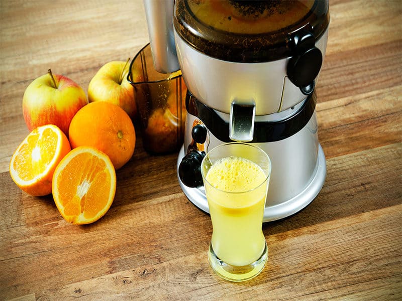 Juice On Wooden Background