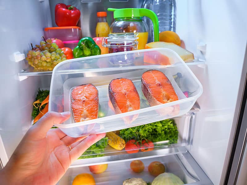 Raw Salmon Steak on Refrigerator