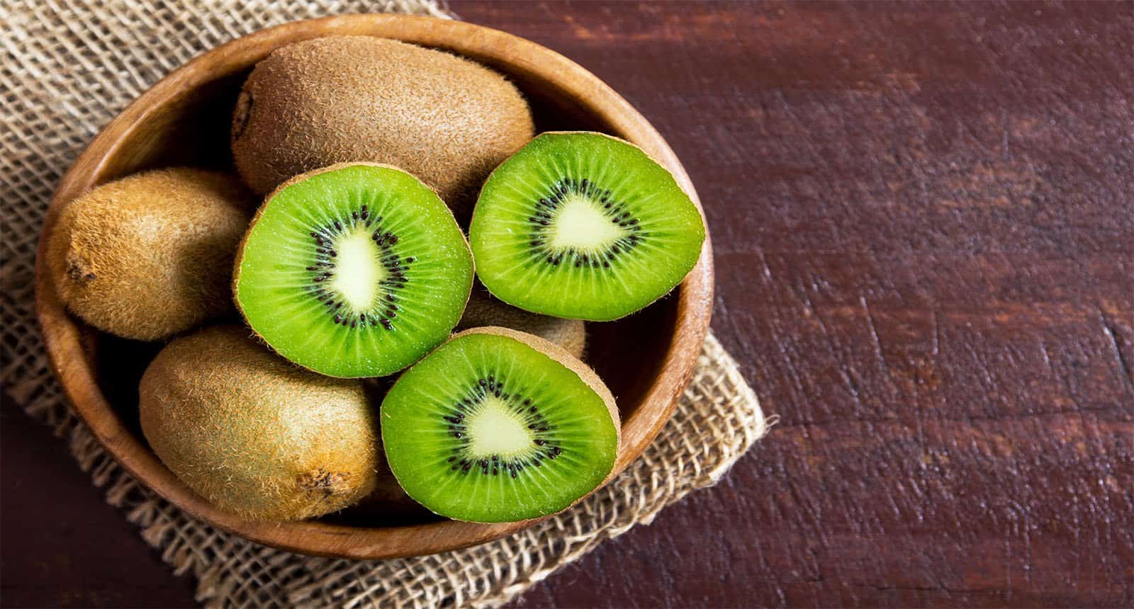 Kiwi Fruit On Wooden