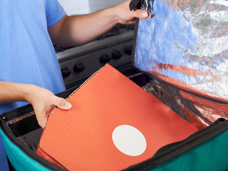 Pizza Delivery Person Putting Food