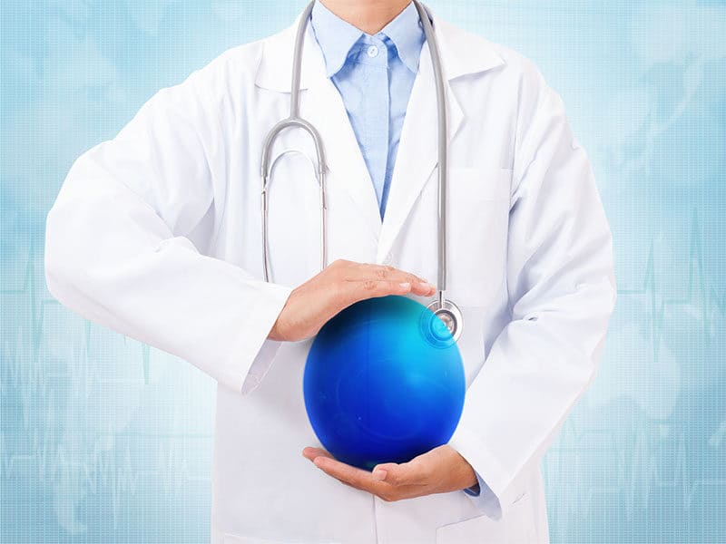 Doctor Holding Blue Crystal Ball