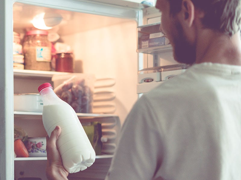 Man Opens Bottle Milk