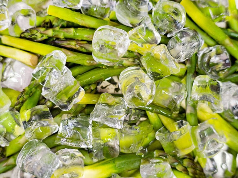 Organic Asparagus On Ice Cubes