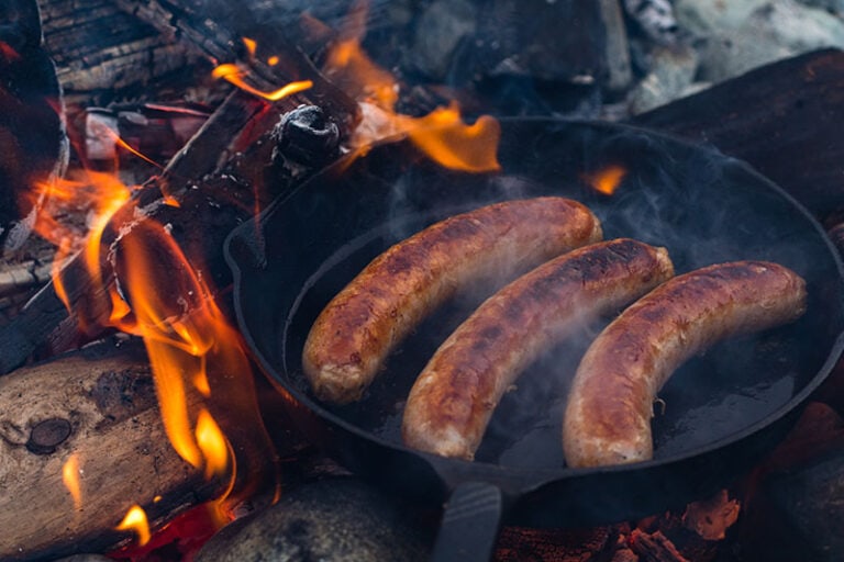 Cooking Juicy Sausages Over