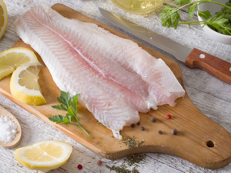 Fillet Fish On Kitchen Board