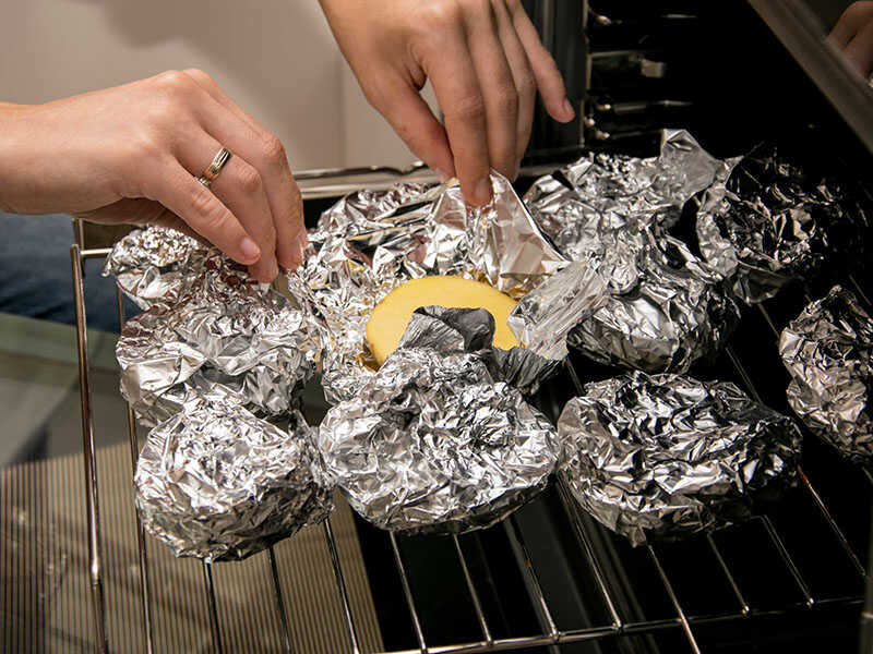 Potatoes Wrapped Aluminum Foil Lying