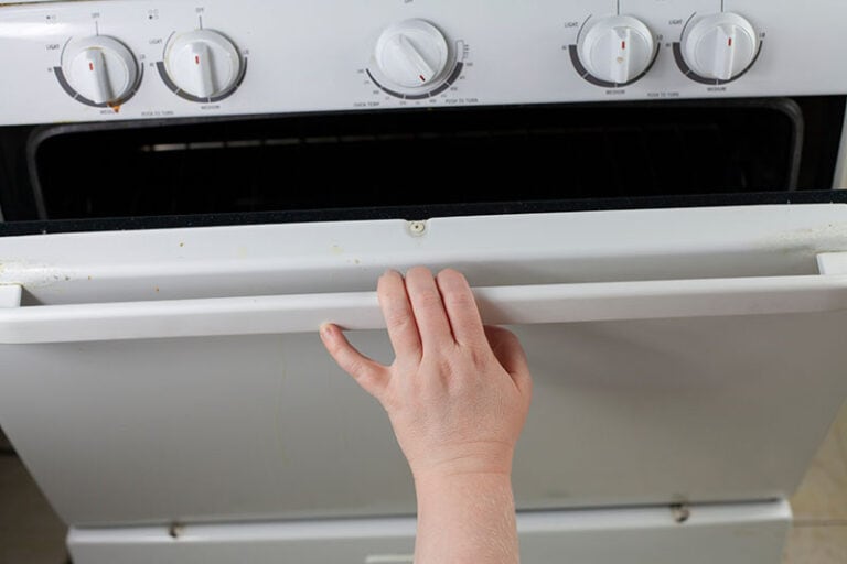 Woman Opening Stove