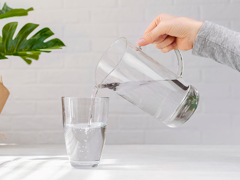 Transparent Jug Fills Glass