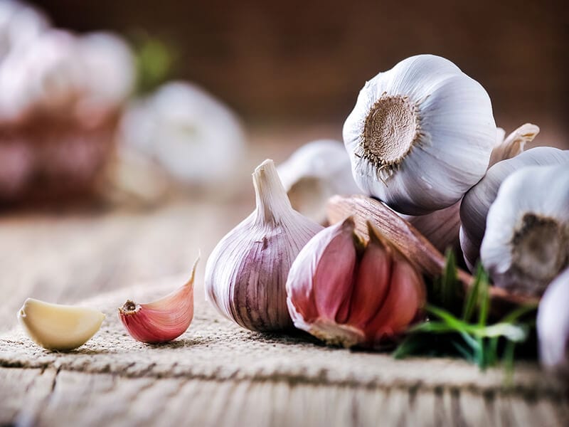 Garlic Cloves On Rustic Table