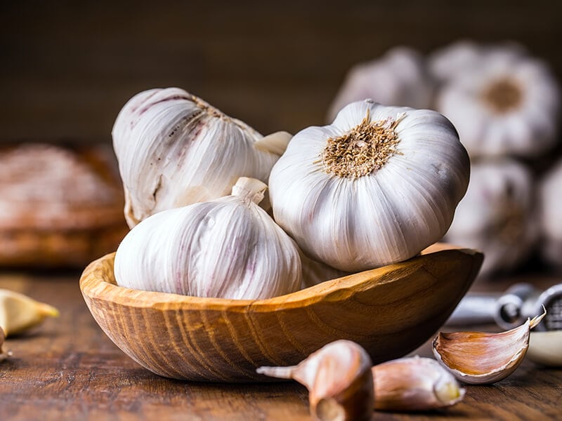 Garlic Cloves With Wooden Bowl