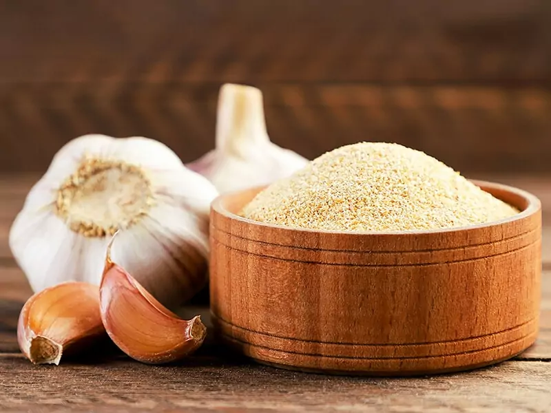 Ground Garlic In Wooden Background