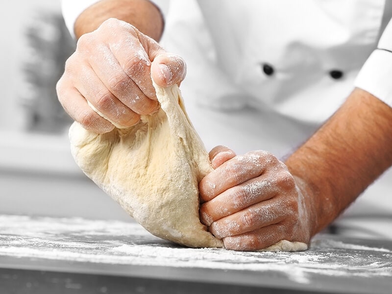 Hands Preparing Dough Pizza