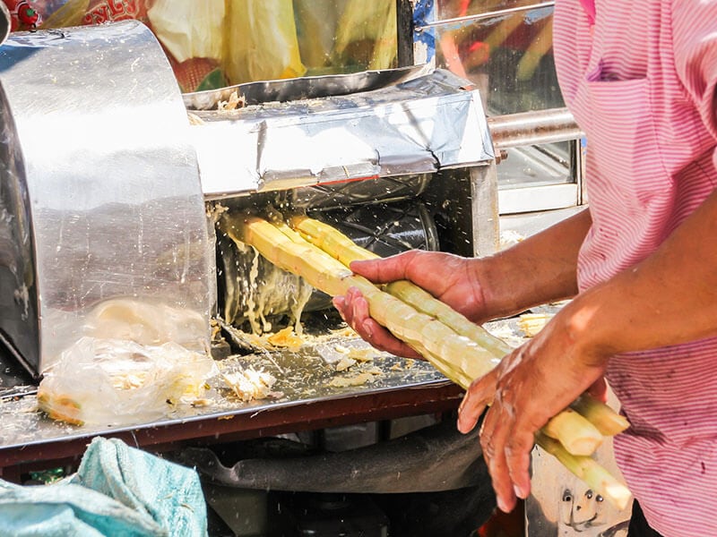 Squeezing Juice Sugar Cane